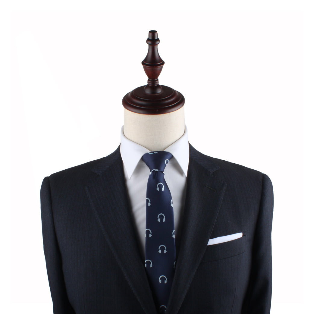 A Headphone Slim Tie mannequin dummy dressed in a suit and tie exudes contemporary elegance.