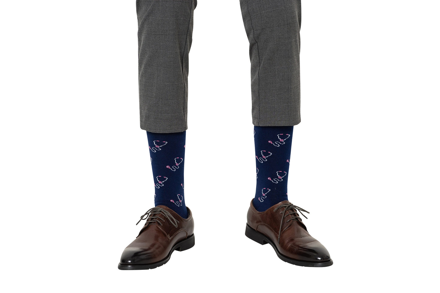 A person wearing brown dress shoes, gray plaid dress pants, and Stethoscope Socks.