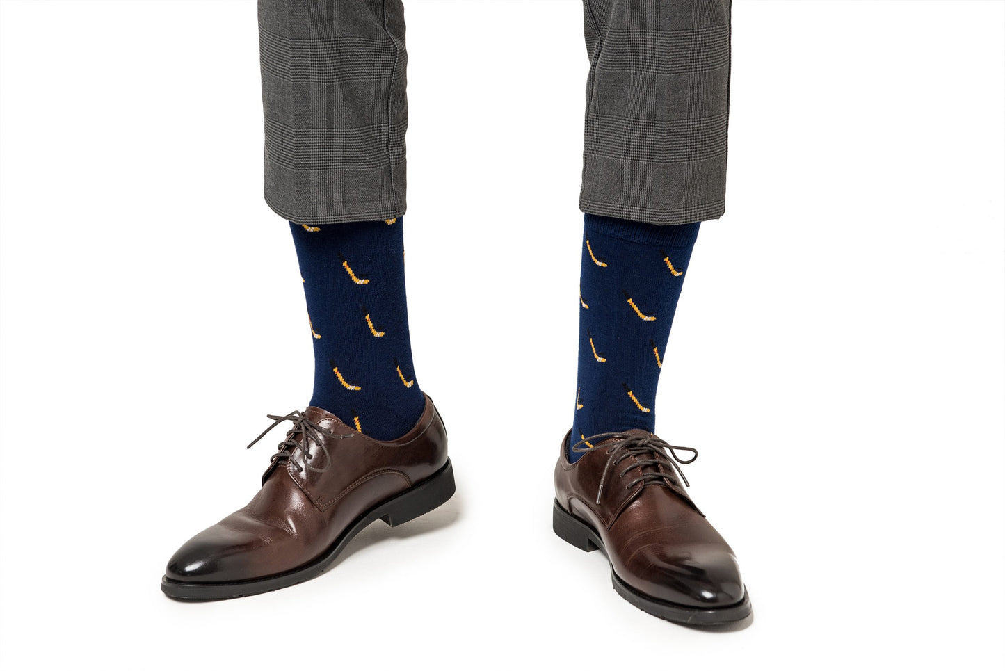 A man wearing a pair of Ice Hockey Socks with bananas on them.