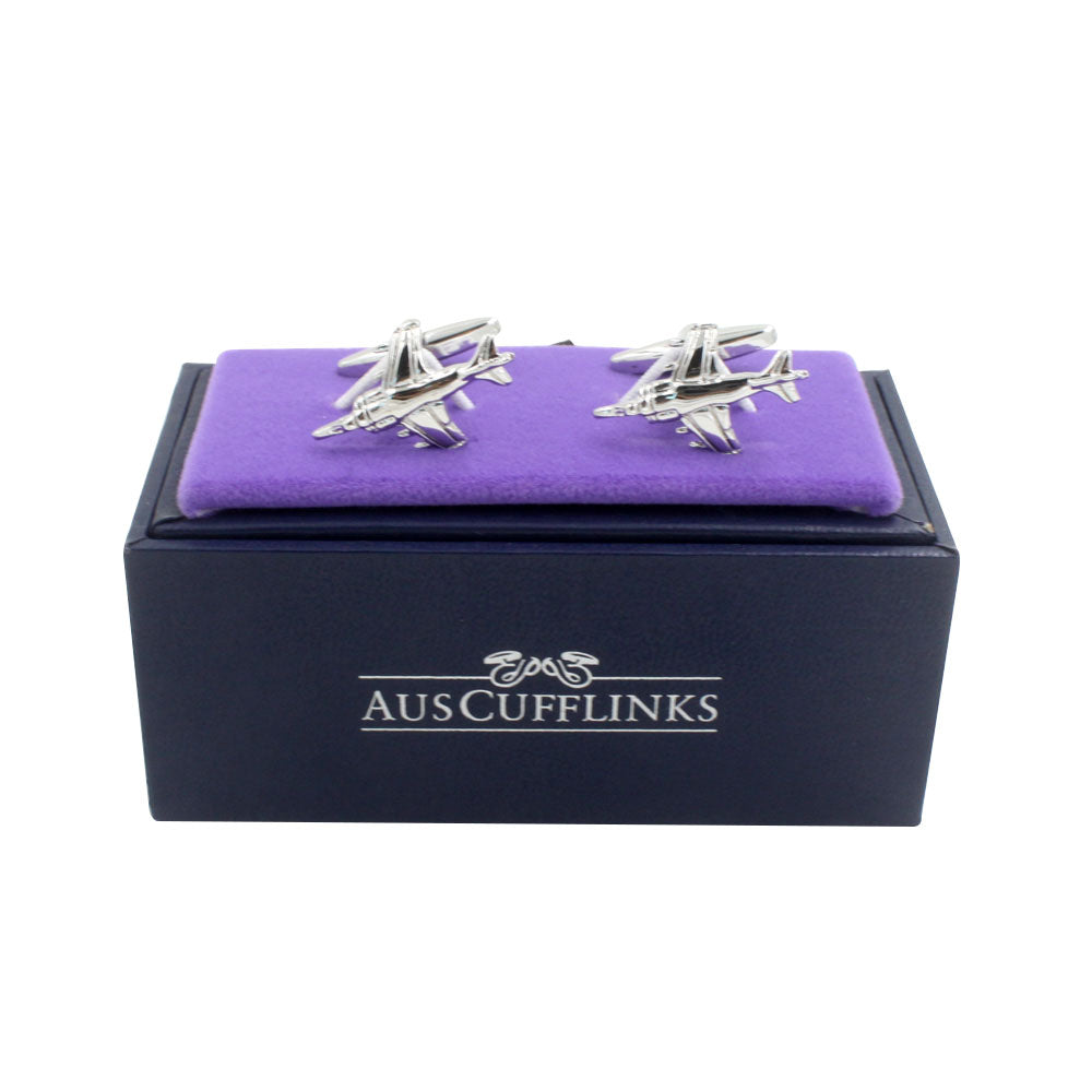 Displayed on a regal purple cushion, the silver Fighter Jet Cufflinks are perfect for aviation enthusiasts. Nestled in a sleek black box adorned with the "AusCufflinks" label, these themed cufflinks are sure to elevate any attire.