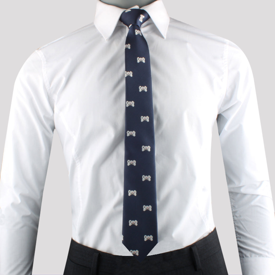 Man wearing a white dress shirt with a Joystick Print Tie, and black pants—perfect for style-conscious trendsetters.