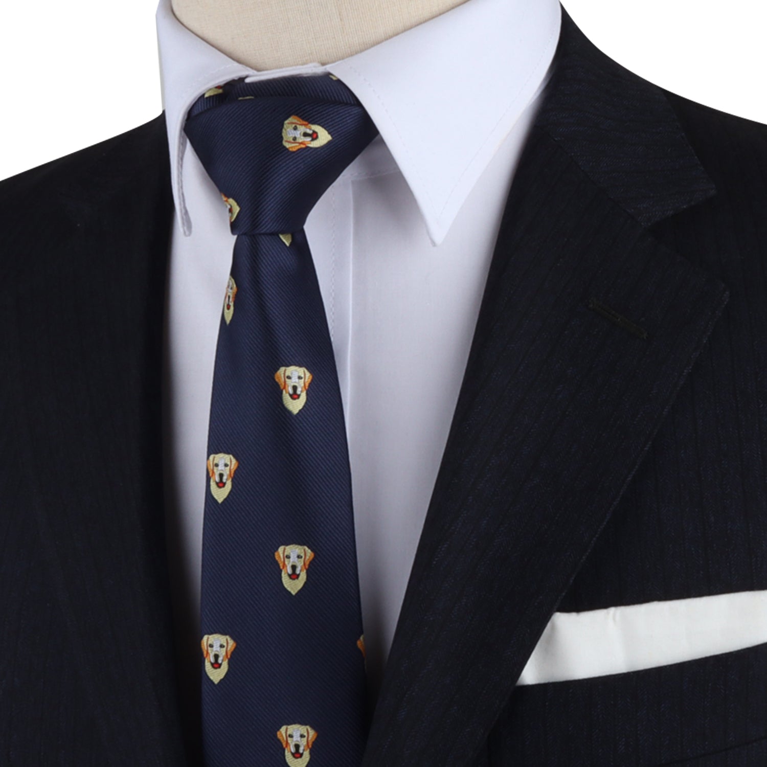 A person in a black suit with a white shirt, wearing a Labrador Dog Fashion adorned with a charming canine pattern, complemented by a crisp white pocket square.