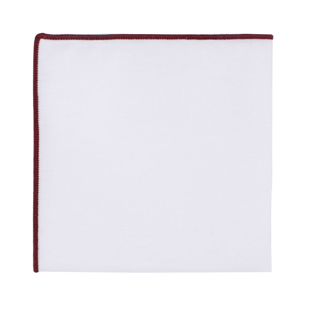 The Maroon Edge White Pocket Square, featuring a sophisticated maroon trim along one edge, laid flat.