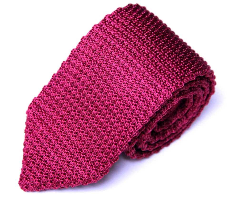 A Burgundy Red Knit Tie on a white background.