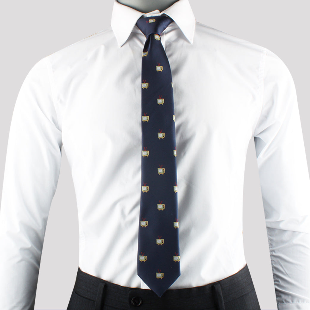 The person exudes elegance in a white dress shirt paired with the Media Themed Tie in blue pattern.