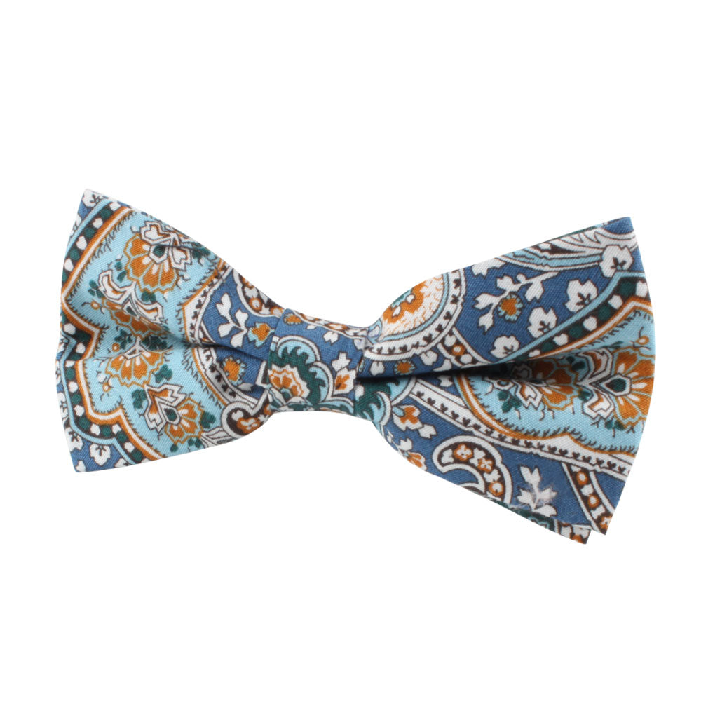Introducing the Blue Paisley Bow Tie, a sophisticated accessory showcasing an elegant pattern in blue, orange, and white on a pristine white background.