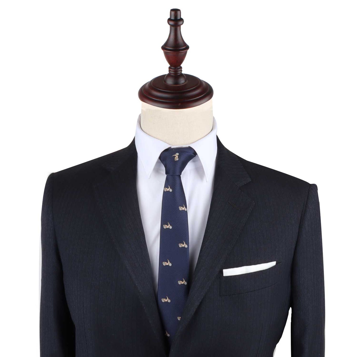 A mannequin dressed in a dark suit, white shirt, and the Motorbike Necktie
, featuring a subtle navy pattern, exudes elegance.