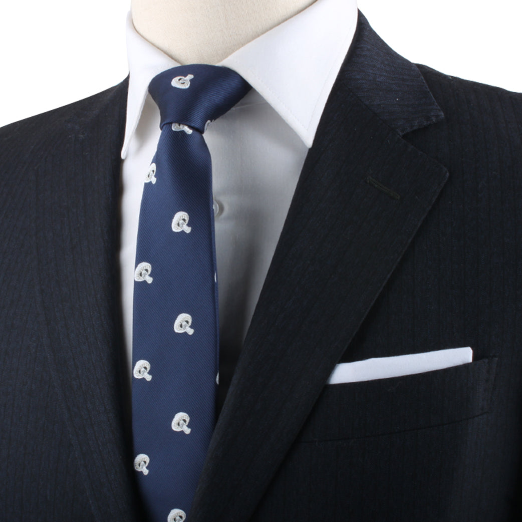 Close-up of a person wearing a black suit, white shirt, and the Mushroom Lover Gift featuring small white logos. A white pocket square is visible in the suit's chest pocket, exuding an air of elegance.