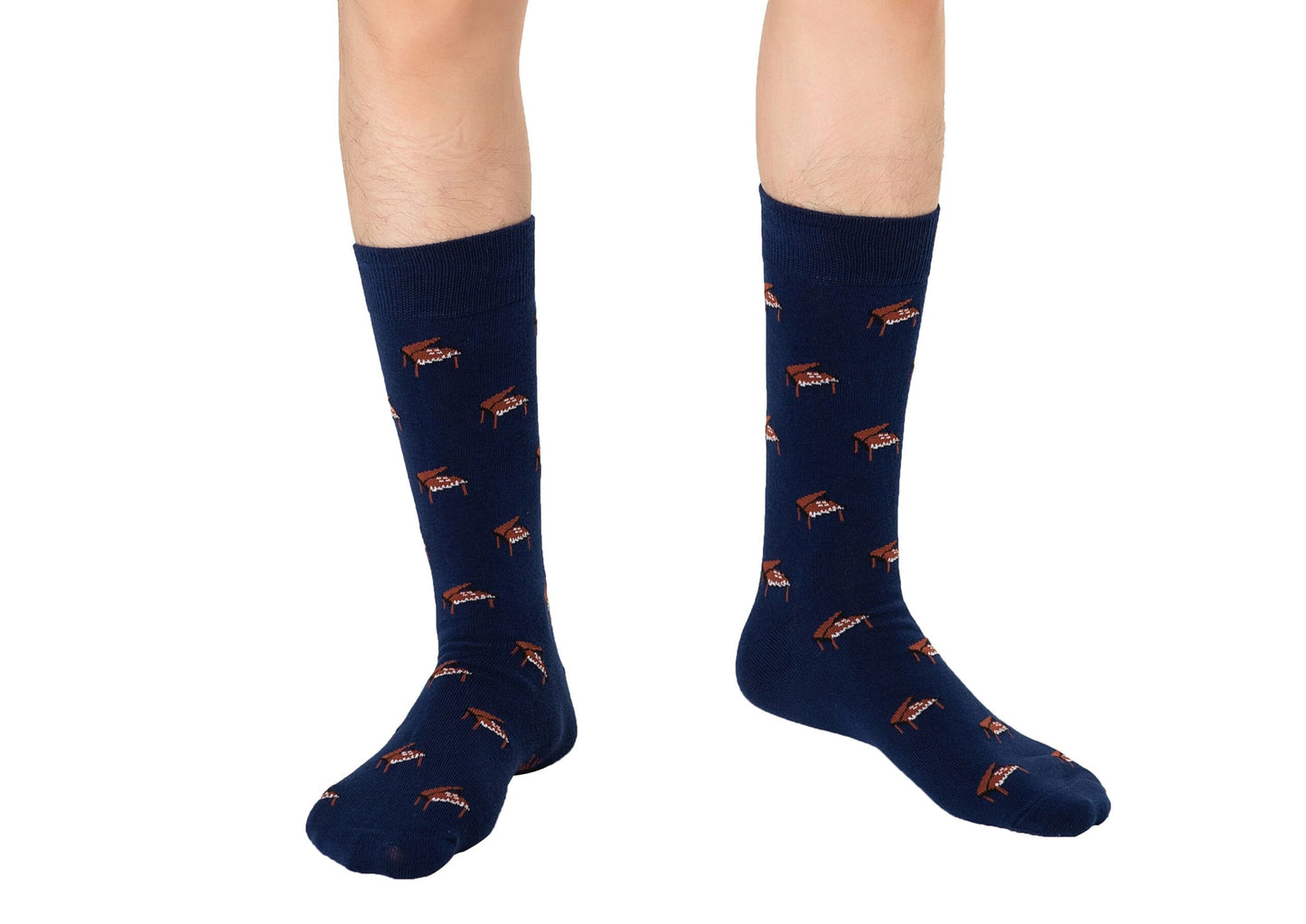 A person wears Piano Socks featuring a dark blue color and a repeating pattern of small brown grand pianos, standing on a white background—ideal music socks for gifts to musicians.