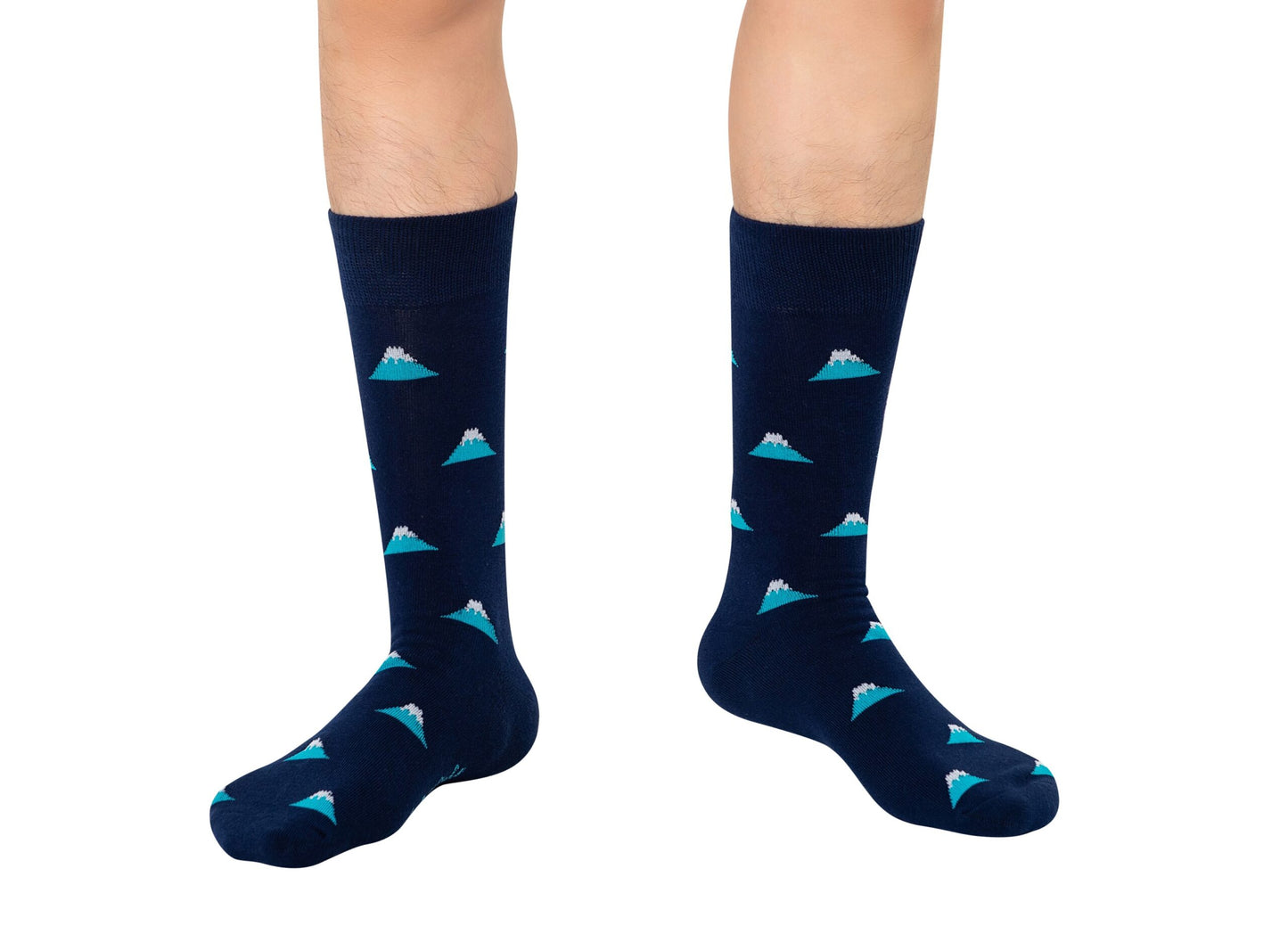 A front view of a pair of feet clad in Mountain Socks, featuring a navy blue base with a light blue mountain peak pattern.