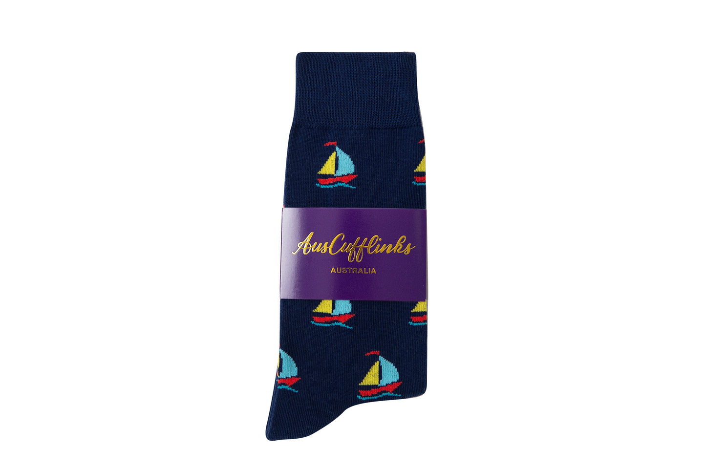 Sail Boat Socks: Navy blue socks featuring colorful sailboat patterns, ideal for ocean lovers, packaged with a purple label that displays "AustCufflinks Australia" in gold text.