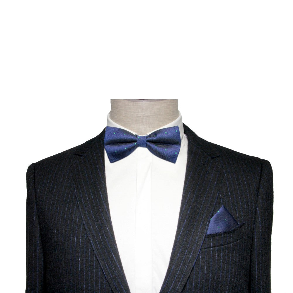 A mannequin wears a black pinstripe suit with a white shirt and a Navy Green Polka Dot Bow Tie, accessorized with a matching pocket square. Perfect for formal events, this outfit exudes sophistication and style.