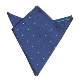 The Navy Green Polka Dot Pocket Square, featuring small green polka dots on a blue background, is neatly folded with one point up. It's an ideal men's fashion accessory for suits, adding sophistication to formal attire.