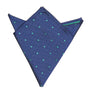 The Navy Green Polka Dot Pocket Square, featuring small green polka dots on a blue background, is neatly folded with one point up. It's an ideal men's fashion accessory for suits, adding sophistication to formal attire.