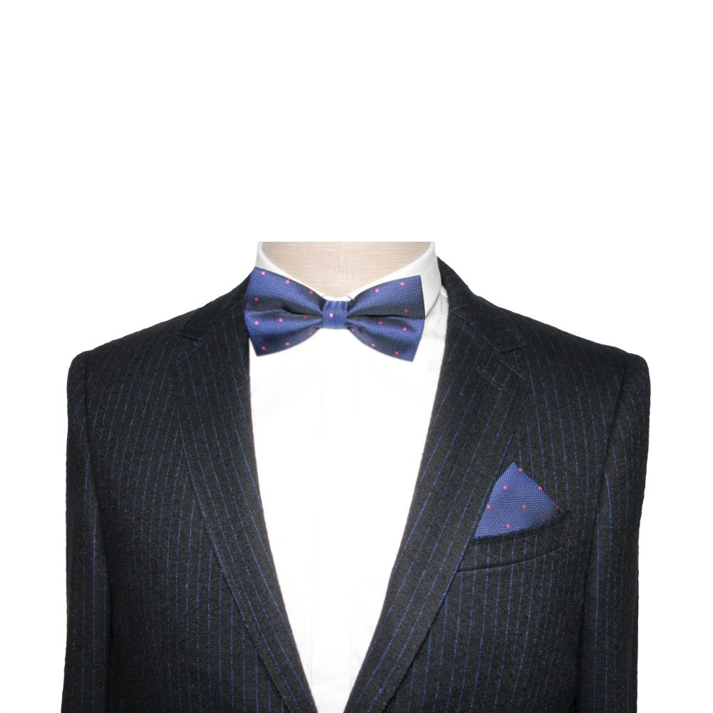 A tailored navy suit with pinstripes, a white dress shirt, a Navy Pink Polka Dot Bow Tie, and a matching pocket square.