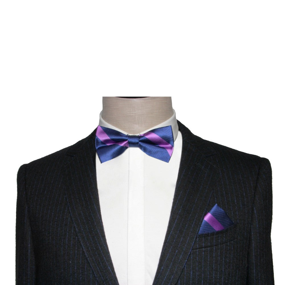 A mannequin wears a black pinstripe suit with a white shirt, featuring an unexpected pop of a Navy Purple Stripe Bow Tie and matching pocket square.