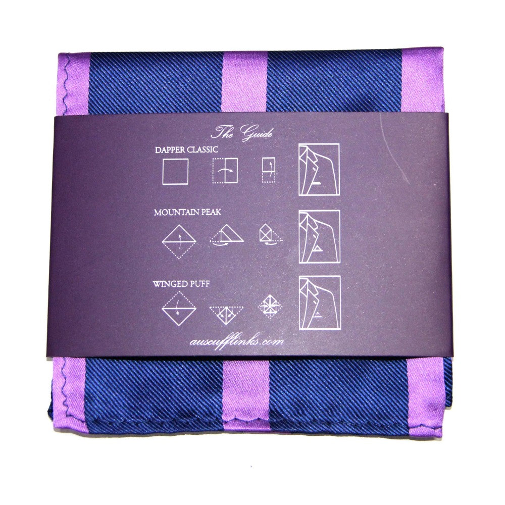Uncover the refined elegance of our Navy Purple Stripe Pocket Square, complete with a folding guide on a stylish dark card, making it easy for any gentleman to enhance his look with sophistication.