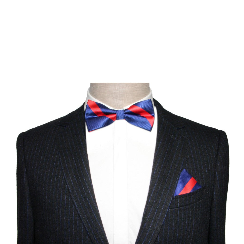 A mannequin exudes classic elegance in a dark pinstripe suit with a Navy Red Stripe Bow Tie and matching pocket square, ideal for formal occasions.