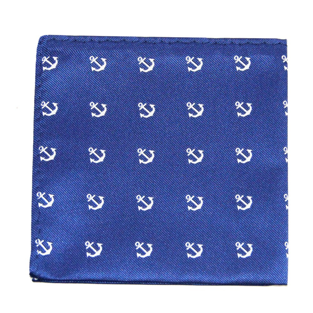 The Navy Anchor Business Tie & Pocket Square Set features a blue pocket square with white anchors, adding nautical charm to any formal look.