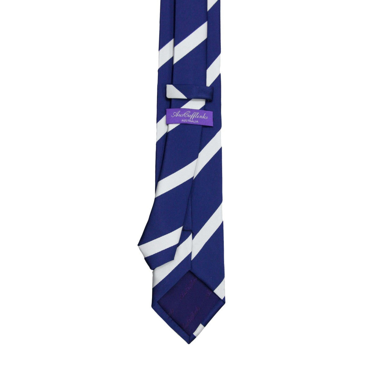 The Navy White Stripe Skinny Tie features blue fabric with diagonal white stripes and a purple label on the back, adding a sharp and classic touch to any outfit.