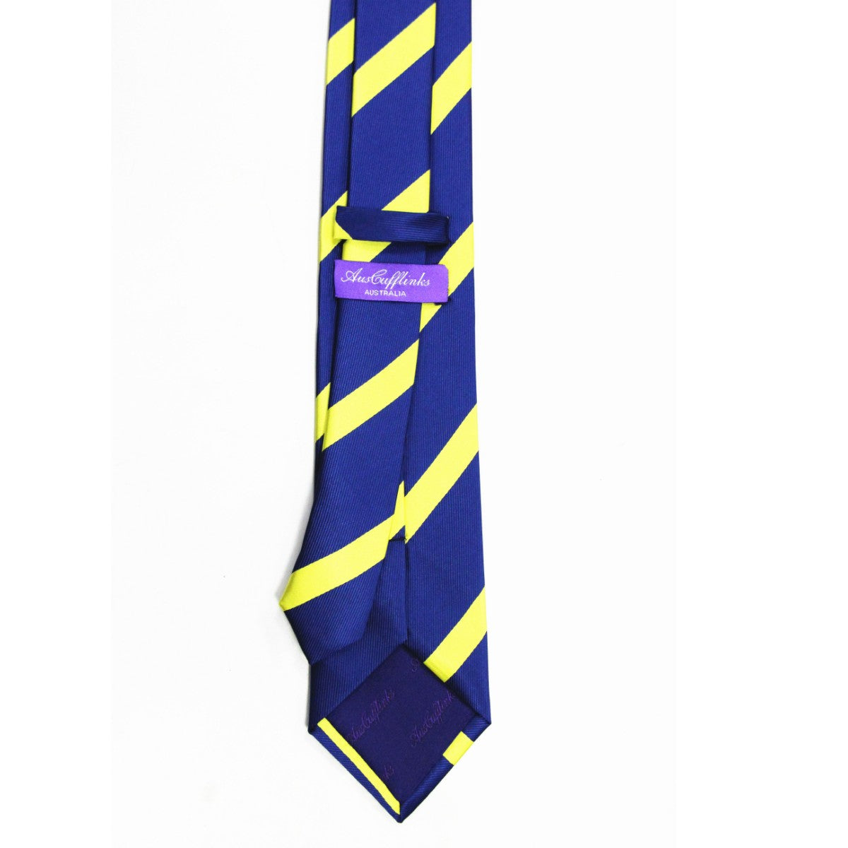 The Navy Yellow Stripe Skinny Tie features blue fabric with diagonal yellow stripes and a purple "Sam Cufflinks" label on the back.