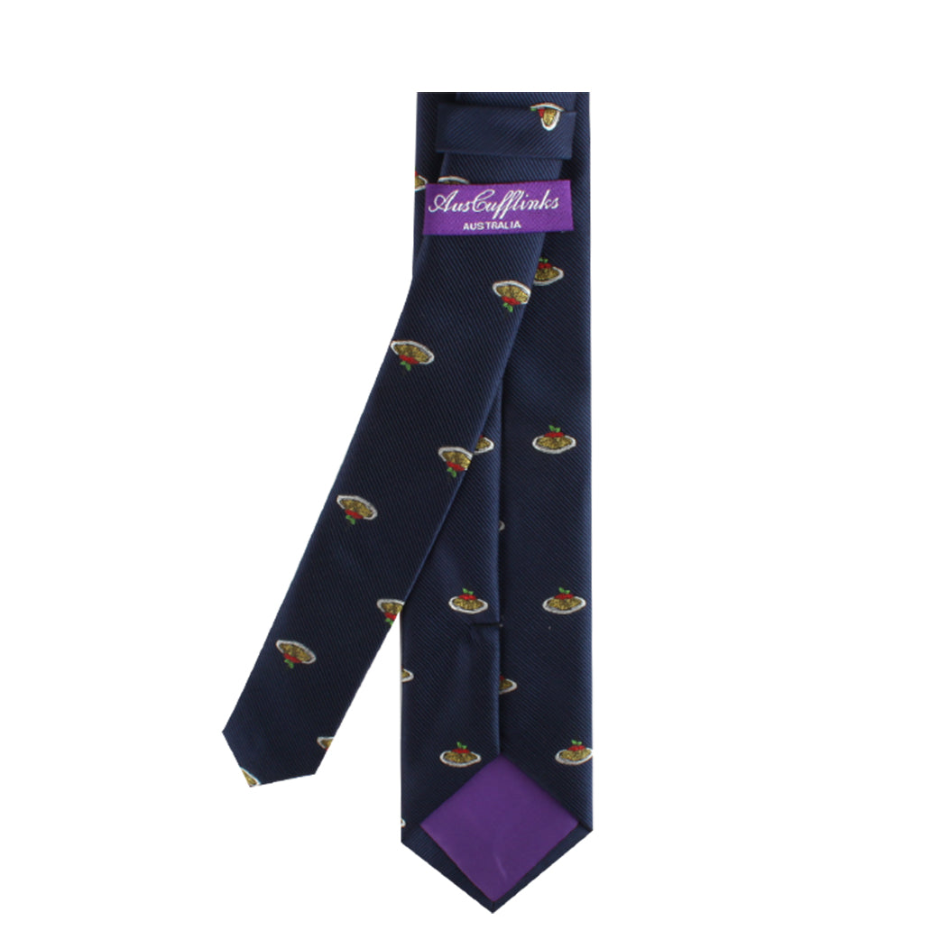 The Pasta Skinny Tie is a navy blue accessory adorned with small, colorful illustrations, complemented by a purple inner lining. It features a label inscribed with "Australia" in purple text, seamlessly blending modern style with Italian flair.