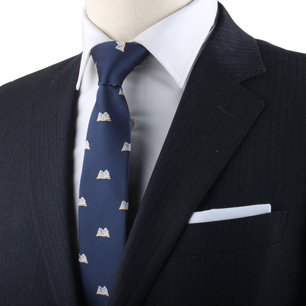 A mannequin showcasing refined fashion in a blue Novel Print Tie suit and tie.