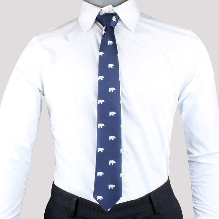A person in a white dress shirt and dark trousers elegantly wears a Novelty Bear Tie, evoking a sense of Arctic wonder.