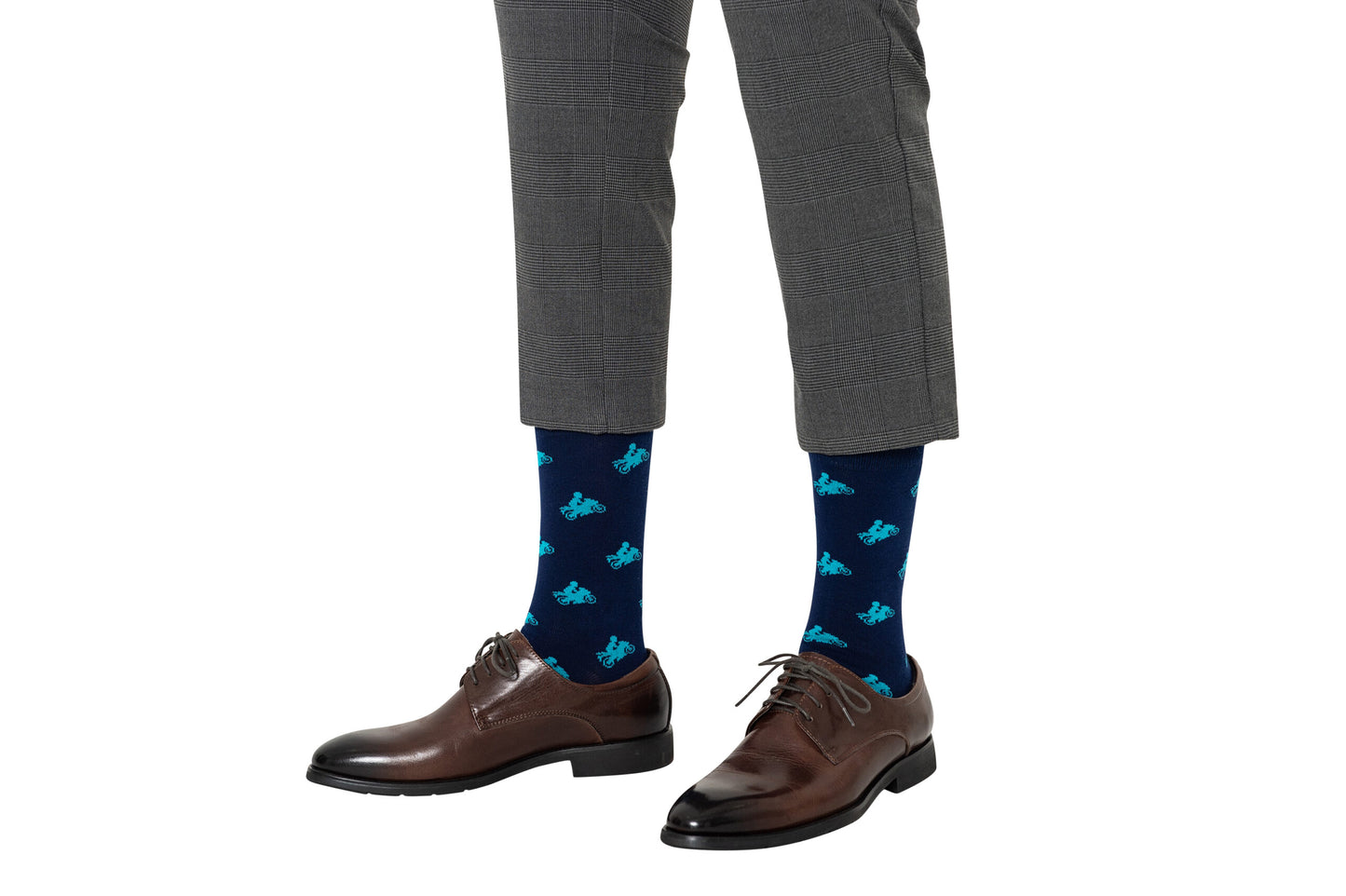 Person wearing gray plaid pants, brown leather dress shoes, and Motorbike Socks—fun blue socks that make a perfect gift for motorcycle lovers.