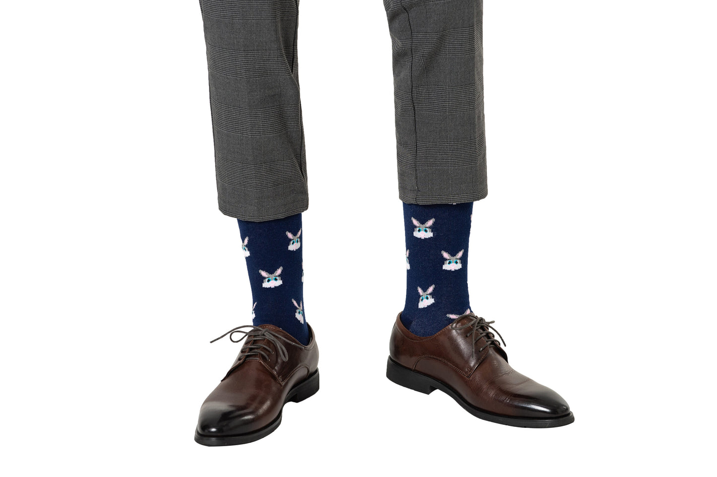 A pair of Bunny Socks adorned in shoes.