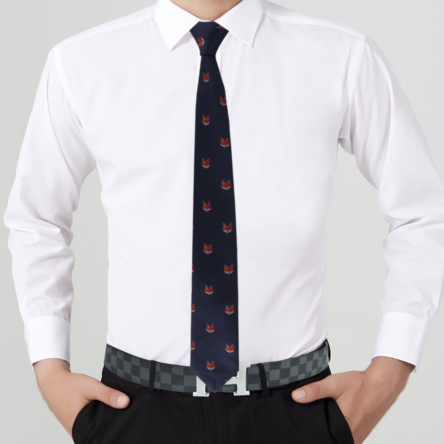 A person wearing a white dress shirt, a Novelty Fox Tie exuding cunning charm, and black pants with a sleek design and checkered belt.