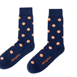 Pair of navy blue Orange Socks with orange coin pattern and citrusy comfort detail on a white background.