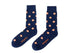 Pair of navy blue Orange Socks with orange coin pattern and citrusy comfort detail on a white background.