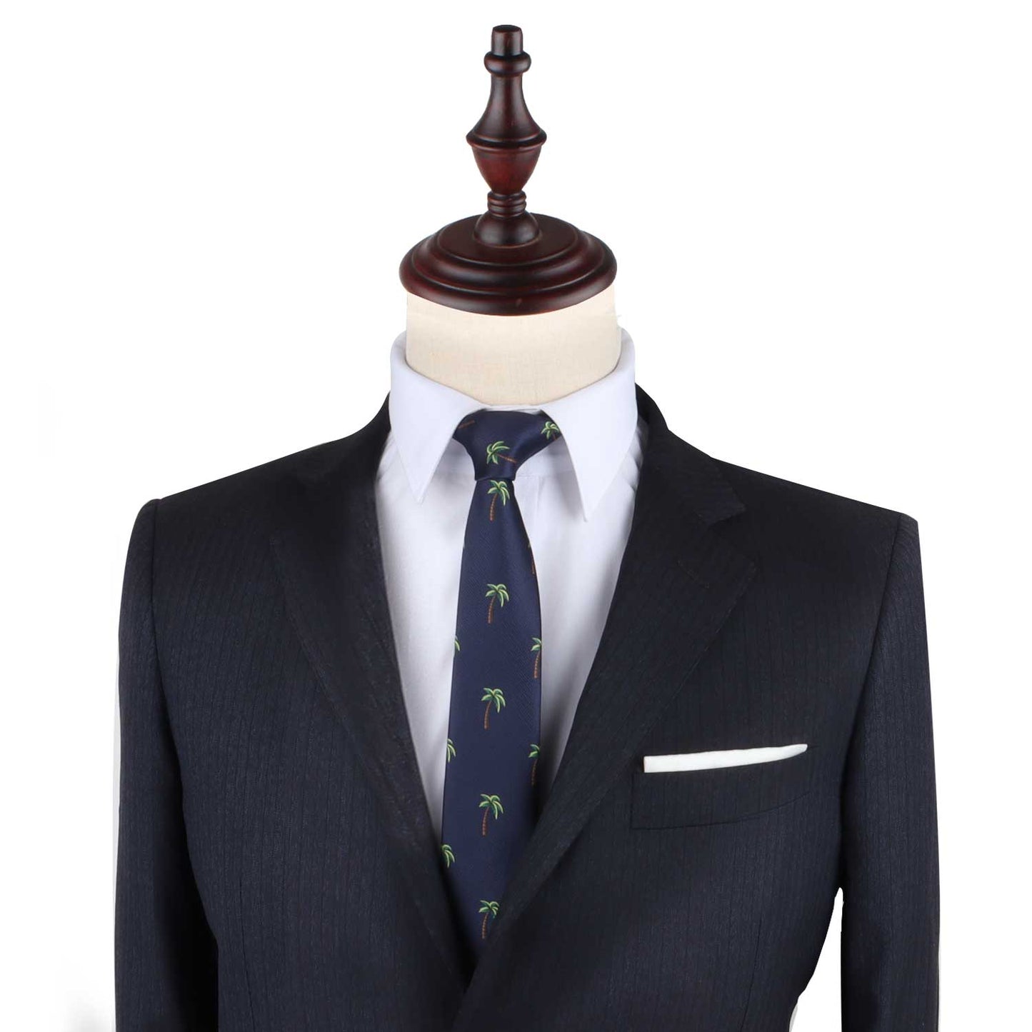 A tailor's mannequin dressed in a dark suit jacket, a white dress shirt, and the Palm Tree Thin Tie featuring a tropical allure palm tree pattern.