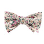 Elevate your style with the Pastel Pink Rose Floral Self Bow Tie, showcasing elegant pink, green, and beige florals on a pristine white backdrop.