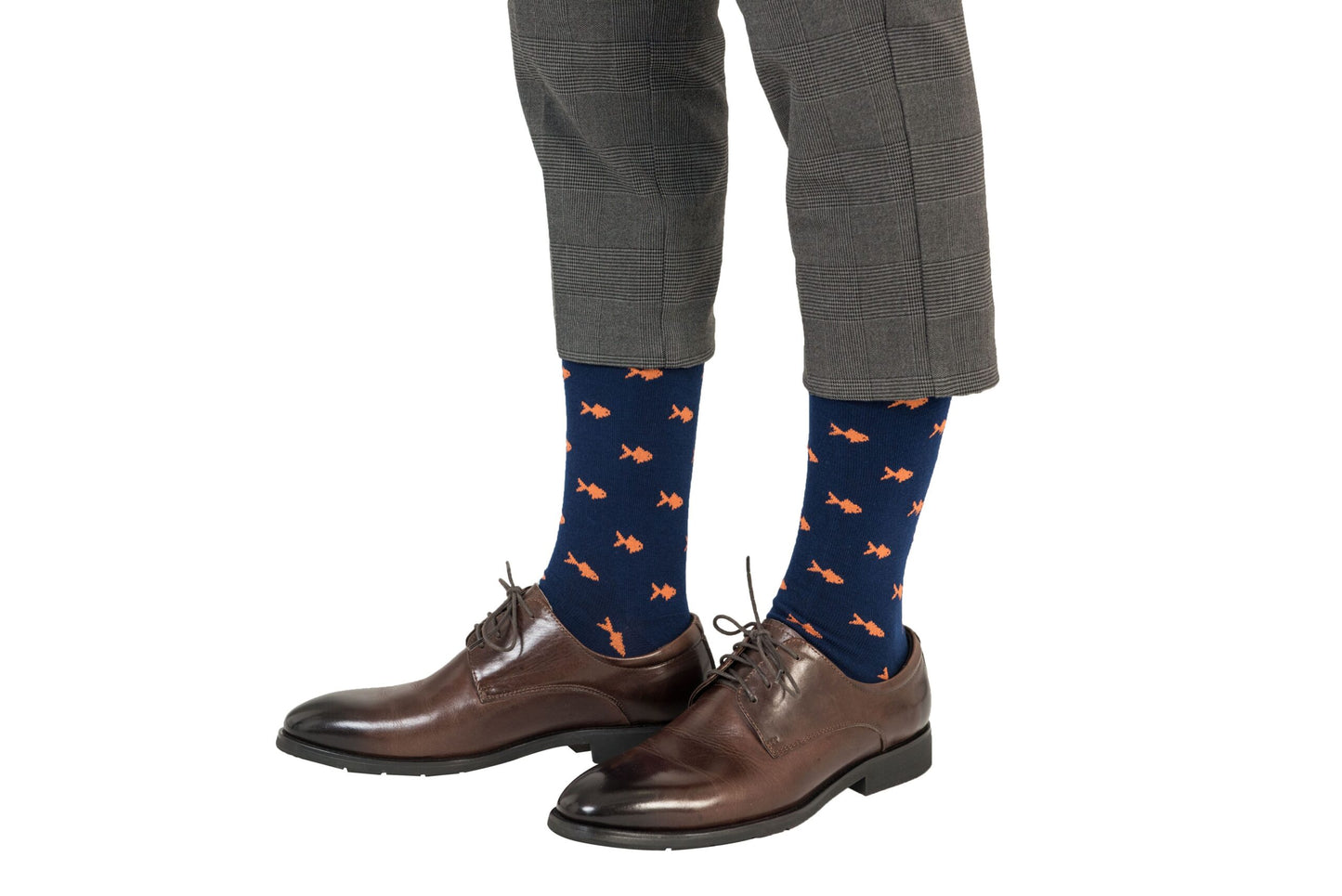 A man wearing a pair of Gold Fish Socks.