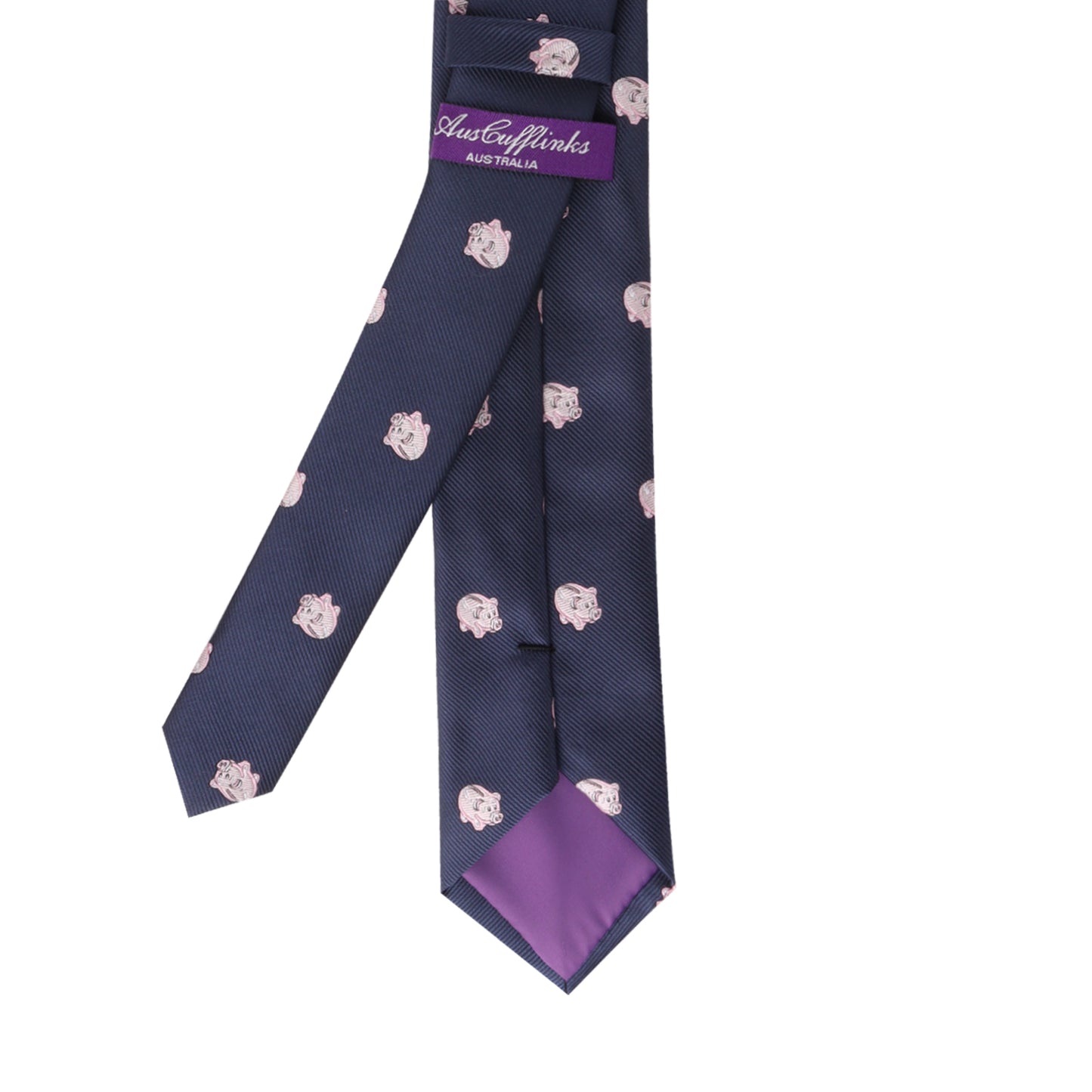 A Piggy Bank Thin Tie with small pink pig-faced designs, featuring a purple label reading "Astor Family Australia" and a purple lining at the tip. Invest in this piece for a touch of sophistication that guarantees you'll standout.