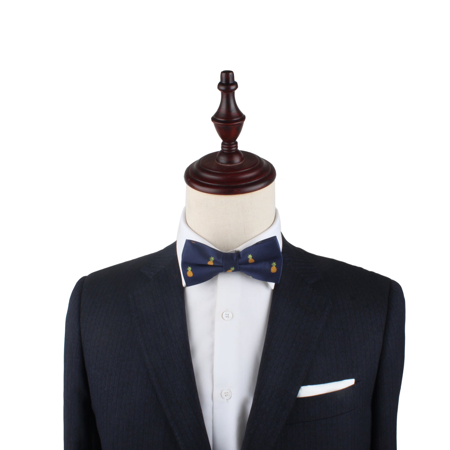 A mannequin dressed in a dark suit jacket, white dress shirt, and a Pineapple Bow Tie exudes a touch of elegance against a plain white background.