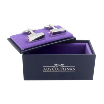 A pair of 4 Pink Stone Cufflinks in a purple box.