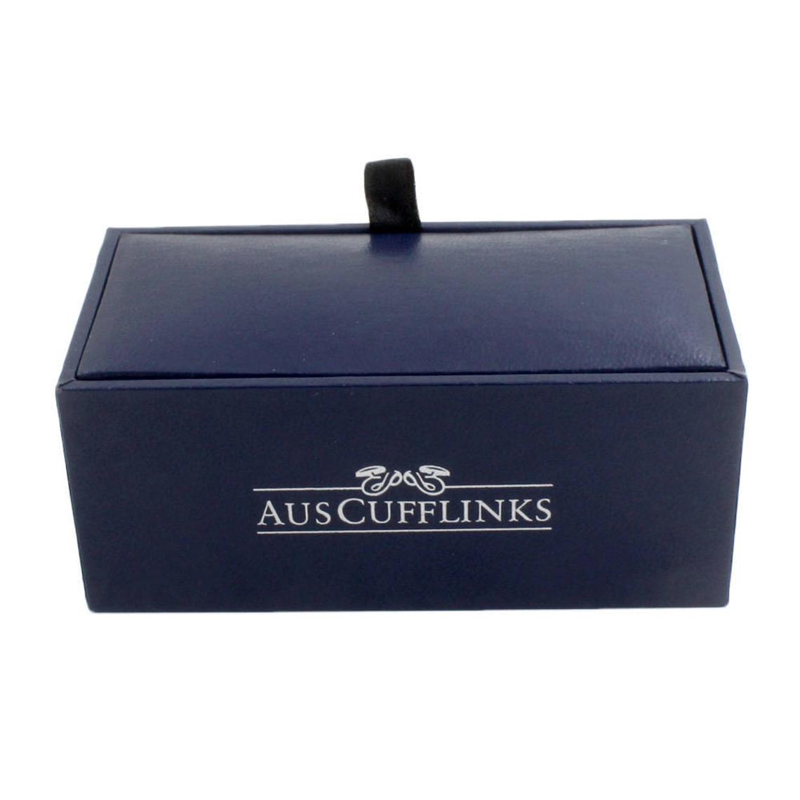 A navy rectangular box, with "AUSCufflinks" printed in white and a black tab, houses the Pink Button Cufflinks, epitomizing refined elegance.