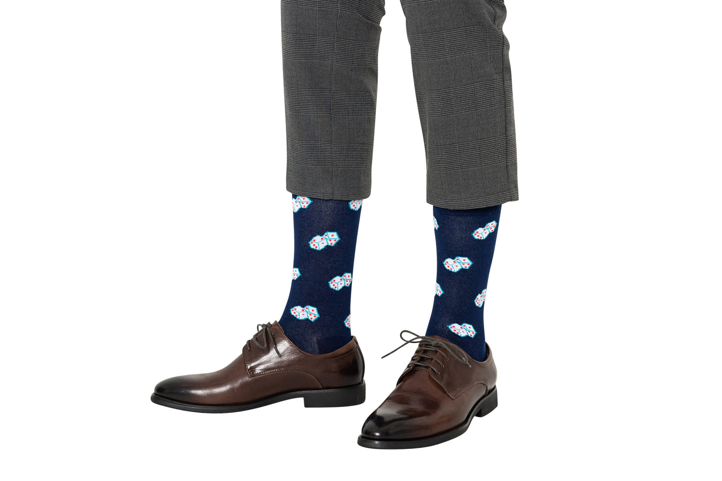A person wearing brown dress shoes, gray checkered pants, and Dice Socks – Lucky Gift for Game Lovers featuring a colorful cloud pattern—perfect for board gamers—stands on a white background.