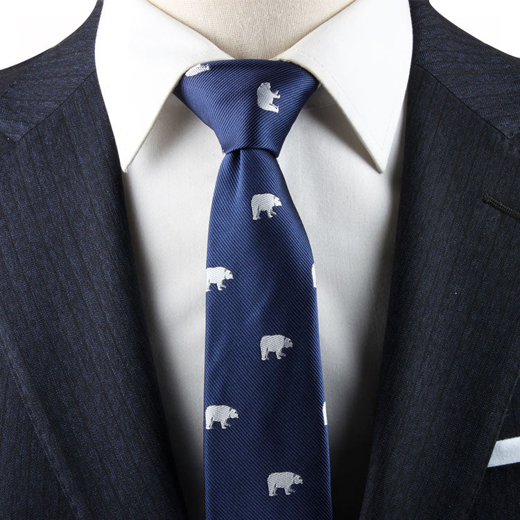 A person wearing a dark blue suit, white dress shirt, and a Polar Bear Necktie exudes an arctic elegance.