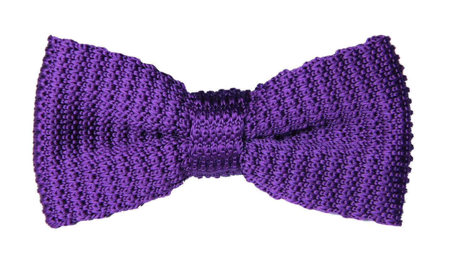 The Purple Knit Bow Tie, shown against a white background, offers a stylish textured design ideal for formal events.