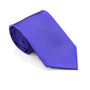 The Classic Purple Skinny Tie, showcasing its sophisticated textured pattern, lies elegantly rolled on a white surface, embodying timeless style.