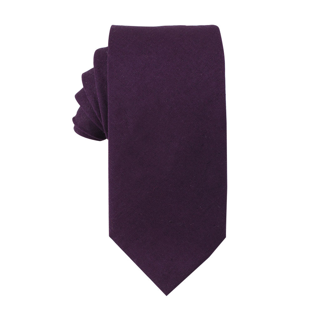 A neatly folded dark purple necktie from the Purple Cotton Business Tie & Pocket Square Set by AusCufflinks, isolated on a white background.