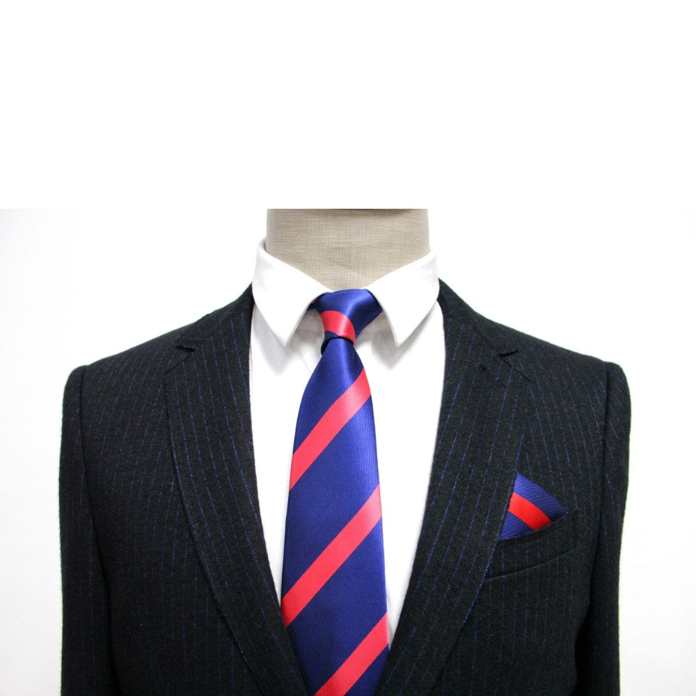 A mannequin dressed for formal occasions features a black pinstripe suit, white shirt, and blue tie with red stripes, accentuated by the Navy Reddish Pink Stripe Pocket Square.