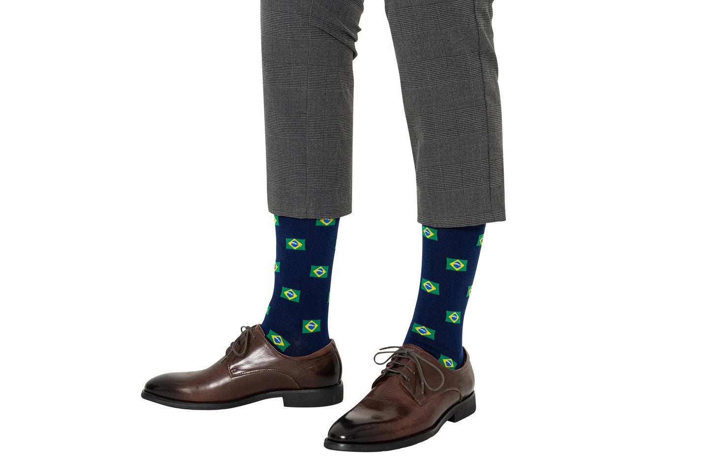 A pair of legs wearing striped pants and Brazil Flag socks.
