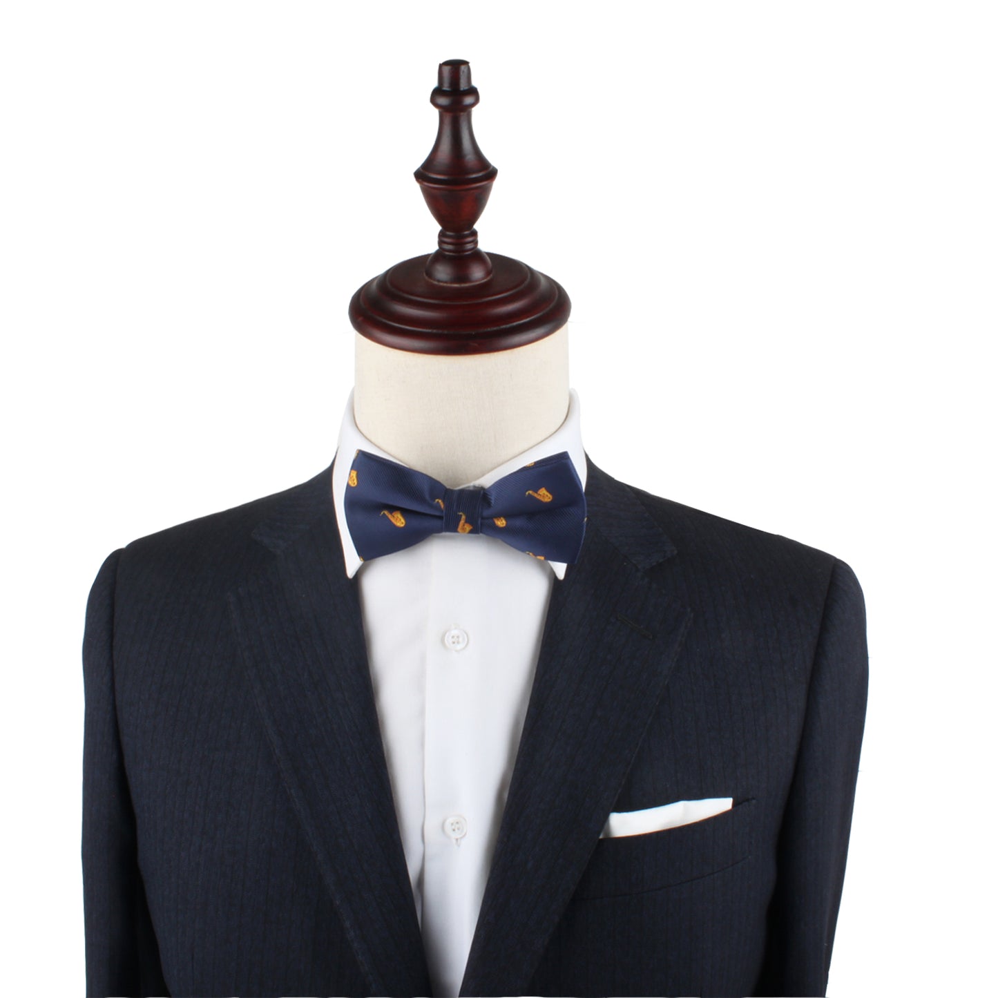 Tailored dark suit with a white dress shirt and a Saxophone Bow Tie. The outfit, displayed on a mannequin with a wooden stand, effortlessly captures an elegant yet whimsical look.