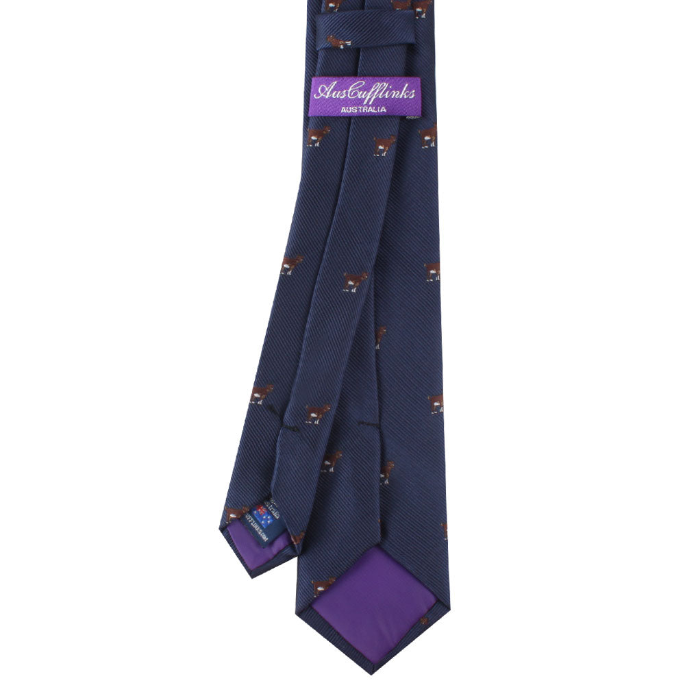 A Skinny Goat Tie with a distinctive purple and blue design on it.