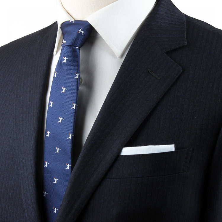 A mannequin with a dynamic style wearing a Slam Dunk Tie and suit.